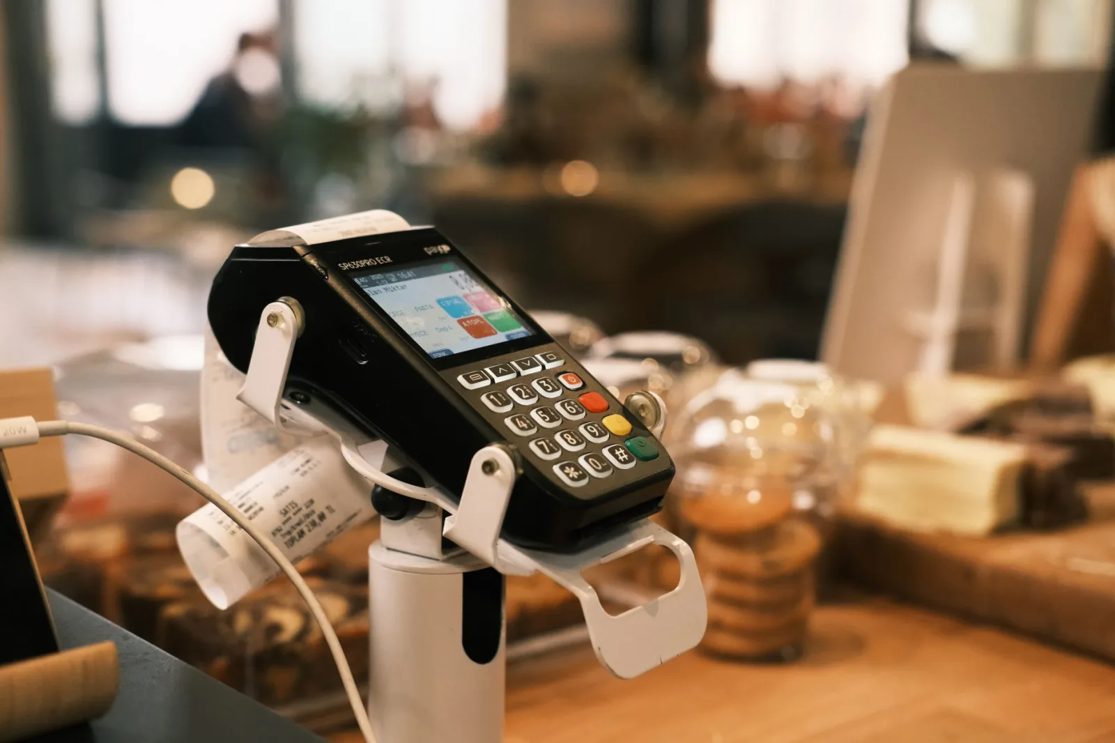 Modern POS system for e-commerce and retail businesses dashboard showing real-time inventory sync, payment processing, and customer data across online and offline channels